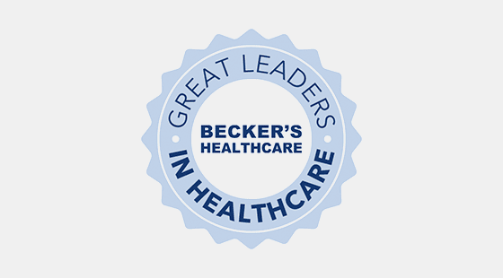 a light blue badge with the words "Great Leaders in Healthcare" around the words "Becker's Healthcare"